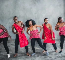 Group of adults participating in an African dance class
