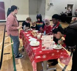 group of children at a breakfast with santa event