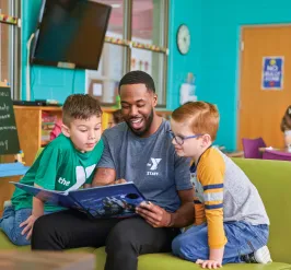 Y Staff Reading to Kids