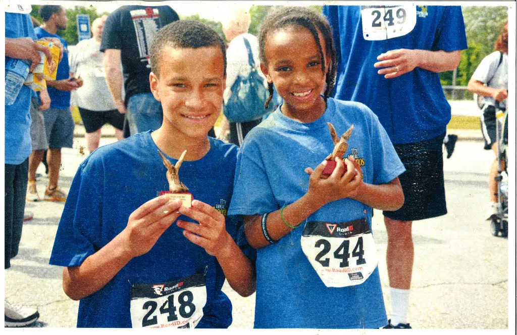 Sean as a child, holding his Cheerios Challenge trophy