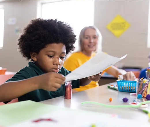 Young child making art