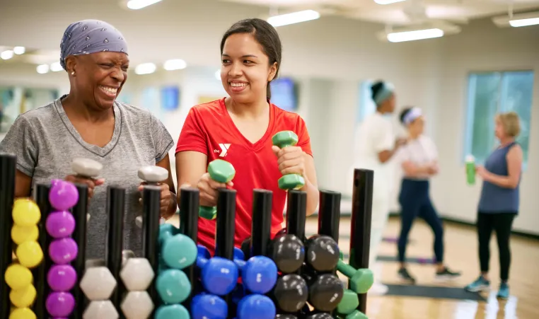 Y staff with member in exercise room