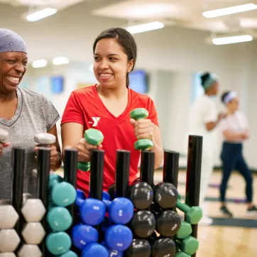 Y staff with member in exercise room