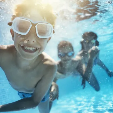children swimming underwater