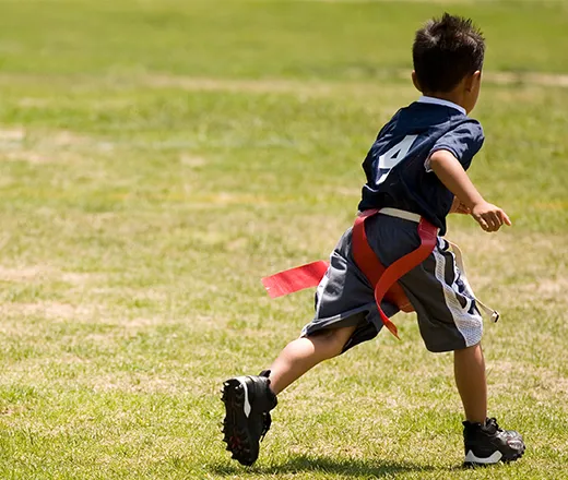 Boy playing flag football