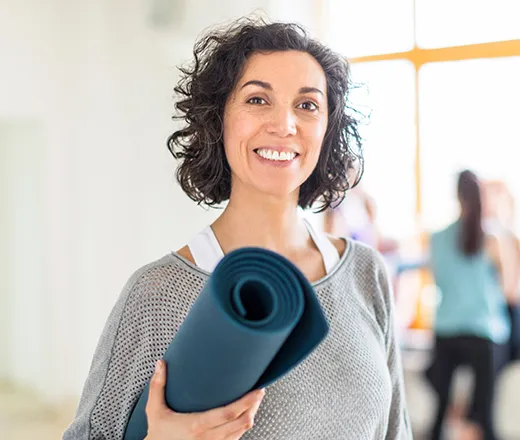 woman smiling after yoga class