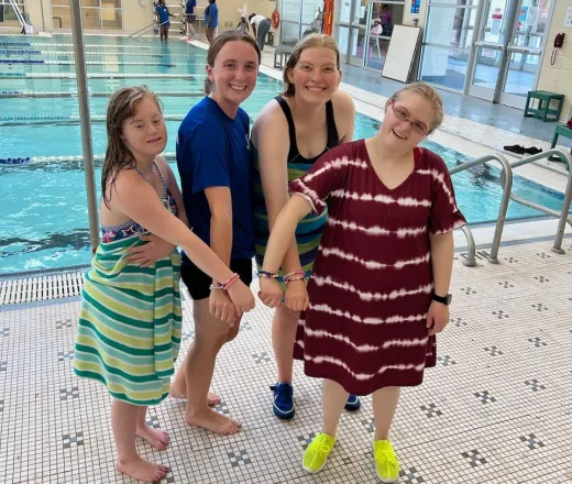 group of swimmers showing off their bracelets