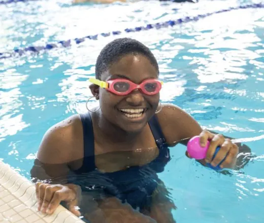 Girl smiling in pool
